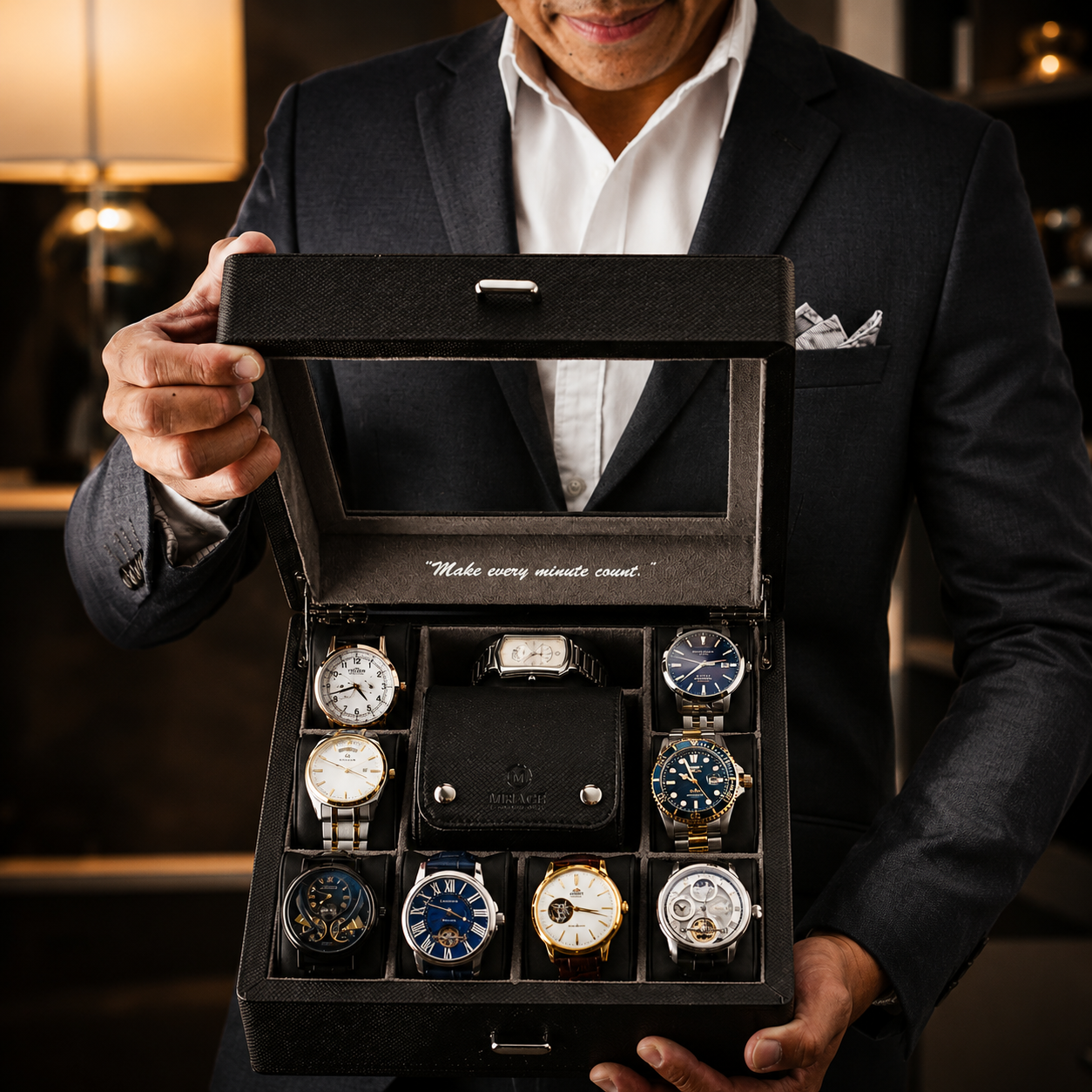 A man in a dark suit holds open a black watch presentation box containing ten wristwatches of various designs and colors. The box has a clear glass window on the lid and the text 'Make every minute count' printed inside.