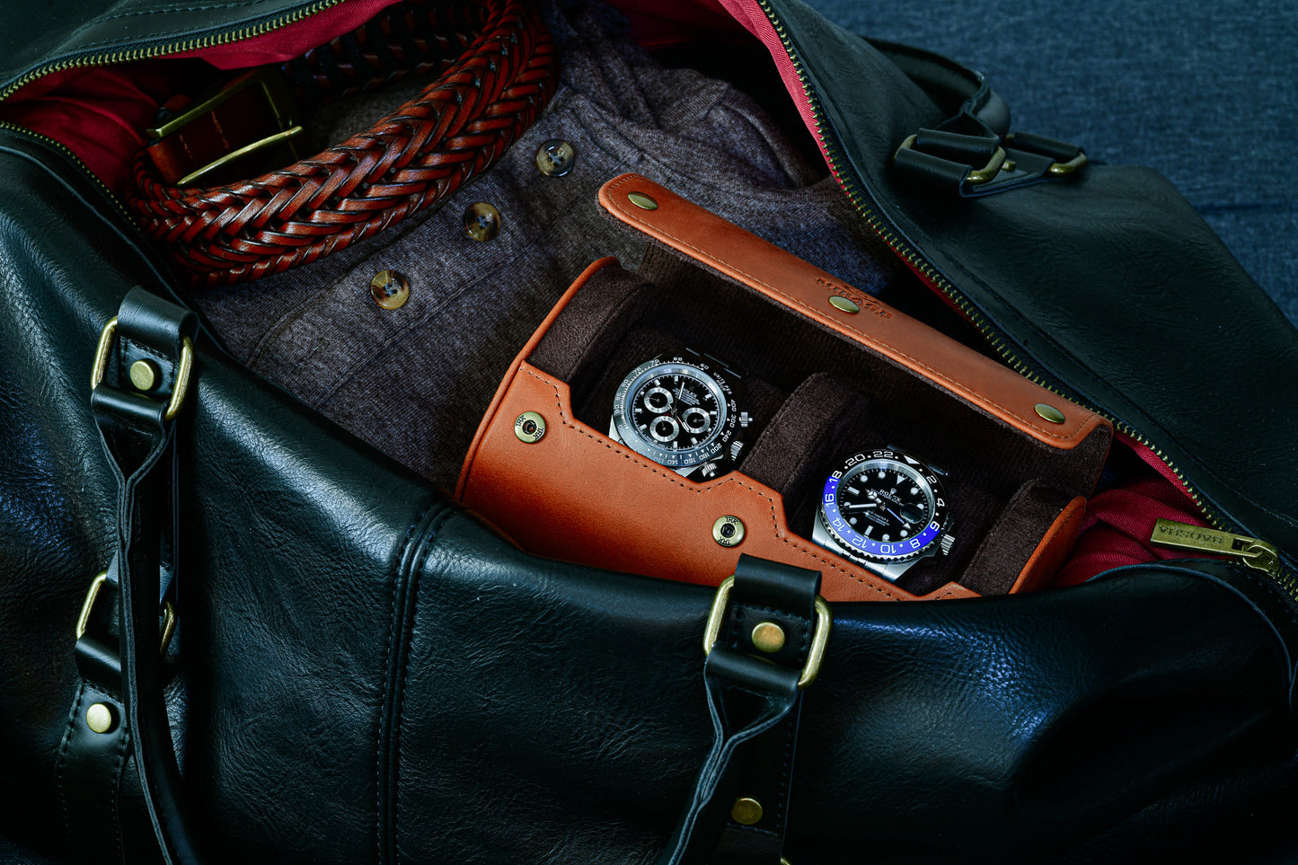 Tawny Brown full-grain leather 2 watch roll inside a travel bag protecting luxury watches during business trips.