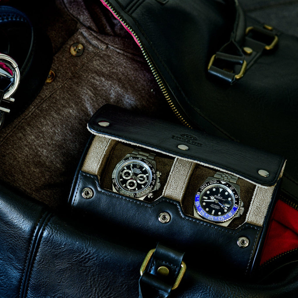 Luxury watches stored inside the Sable Black 2 watch roll with travel accessories.