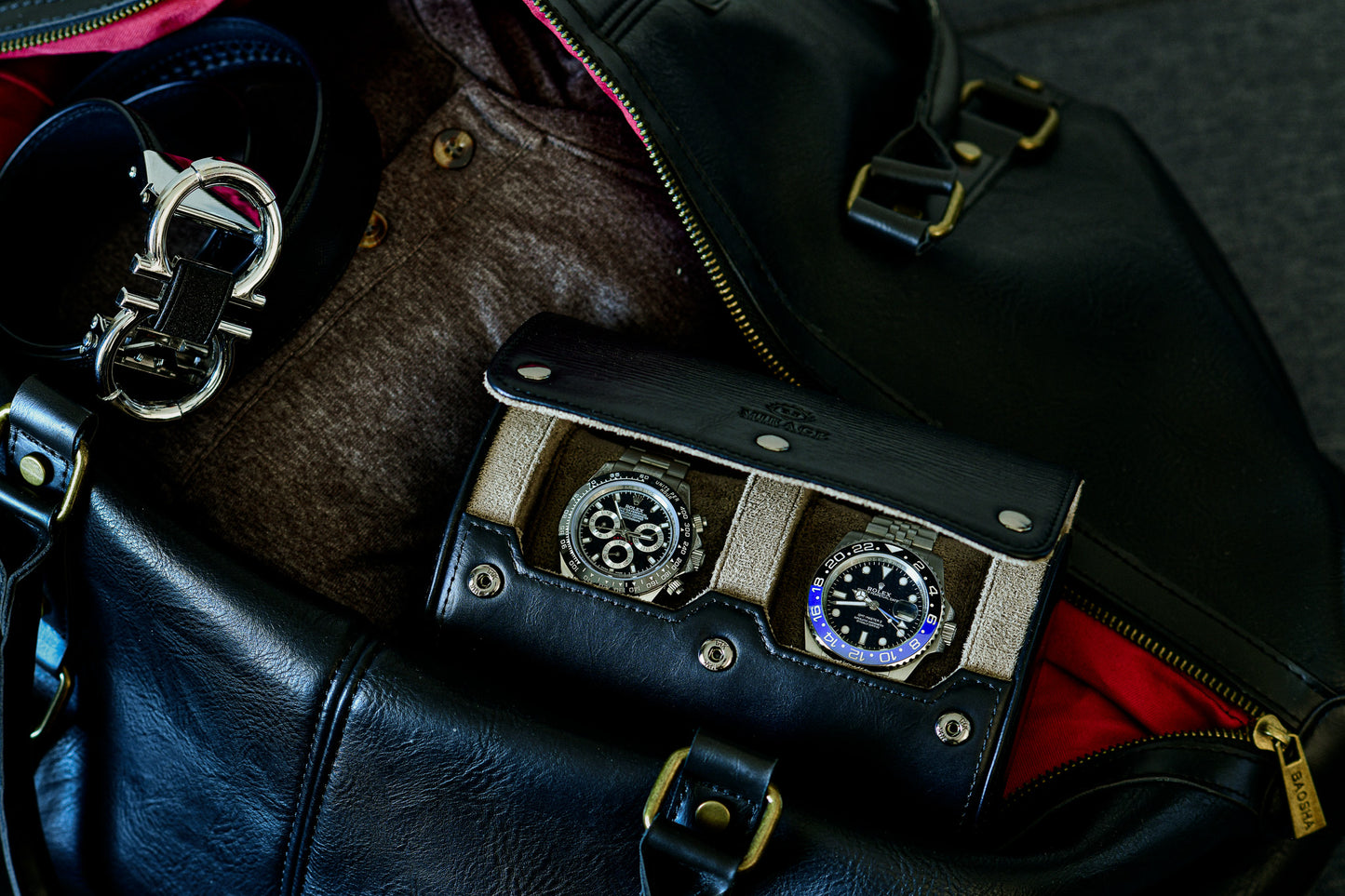 Luxury watches stored inside the Sable Black 2 watch roll with travel accessories.