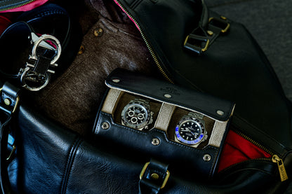 Luxury watches stored inside the Sable Black 2 watch roll with travel accessories.