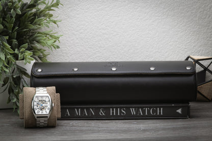 Sable black full-grain leather watch roll displayed beside a luxury watch for home organization.
