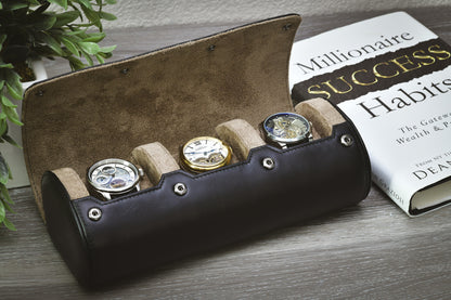 Luxury watch organizer displaying three luxury watches on a bookshelf for home storage.