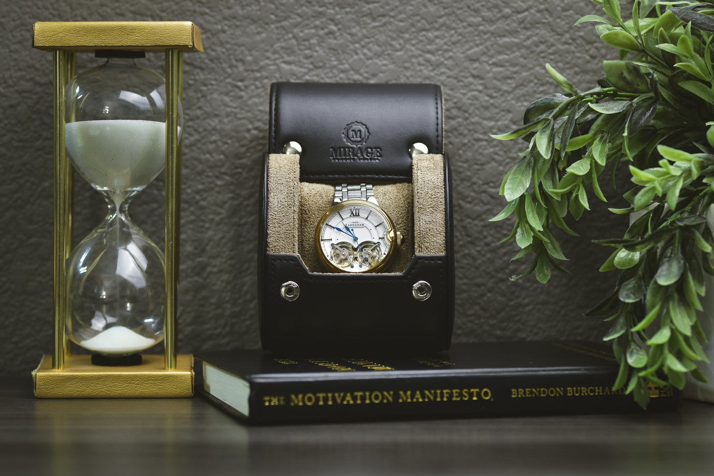 Sable Black full-grain cow leather 1 watch roll displayed with the Mirage Luxury Travel gift box, luxury watch, hourglass, and plant for an elegant collector presentation.