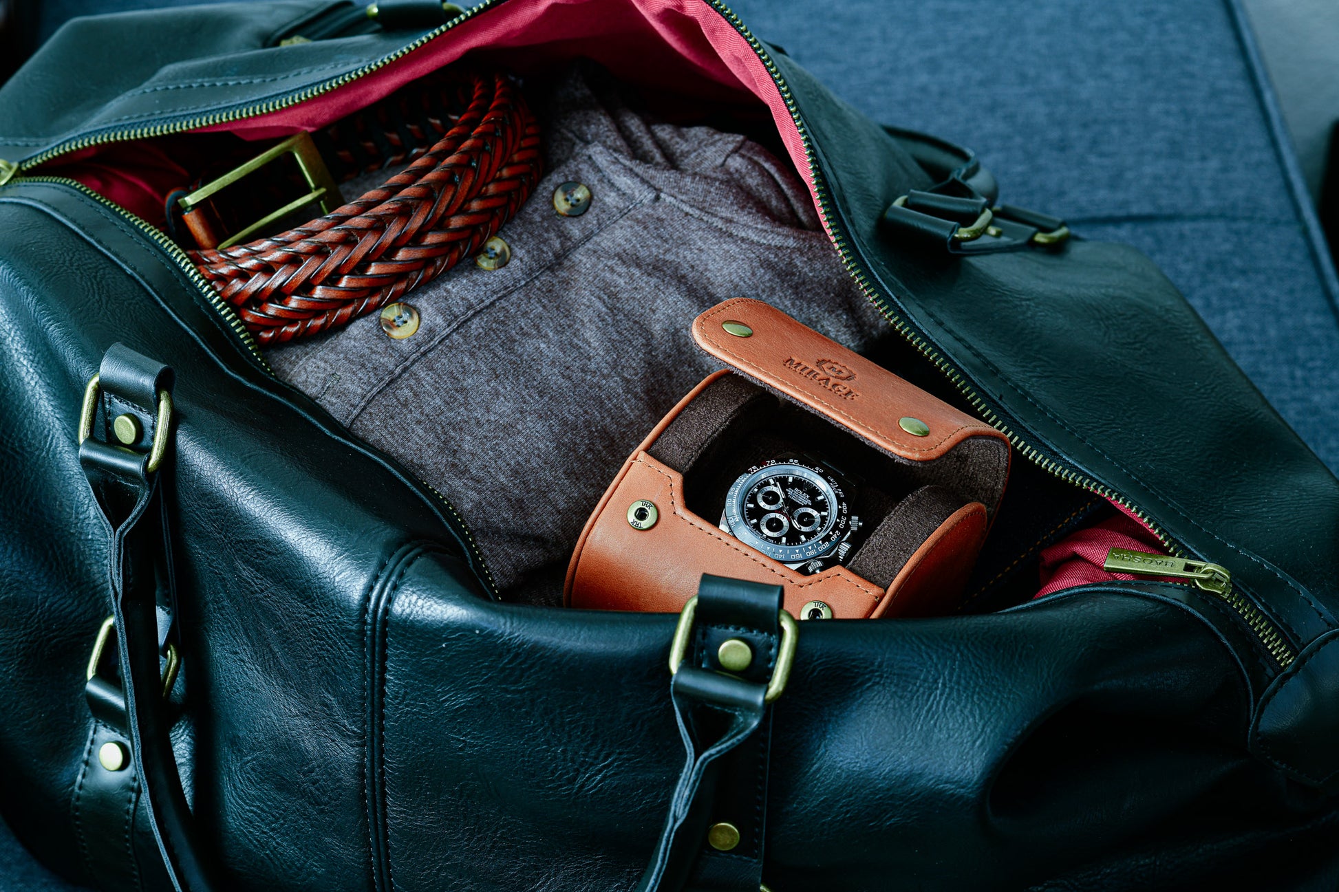 Tawny Brown full-grain cow leather 1 watch roll stored inside a travel bag, ideal for protecting luxury watches while traveling.