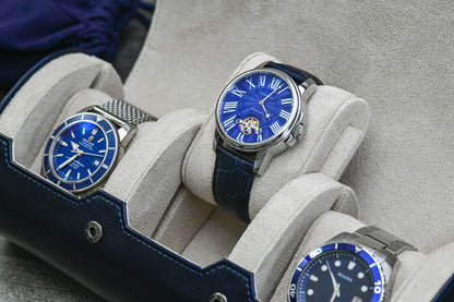 Close-up of luxury watches secured inside Midnight Blue 3 watch organizer with ivory white suede watch cushions