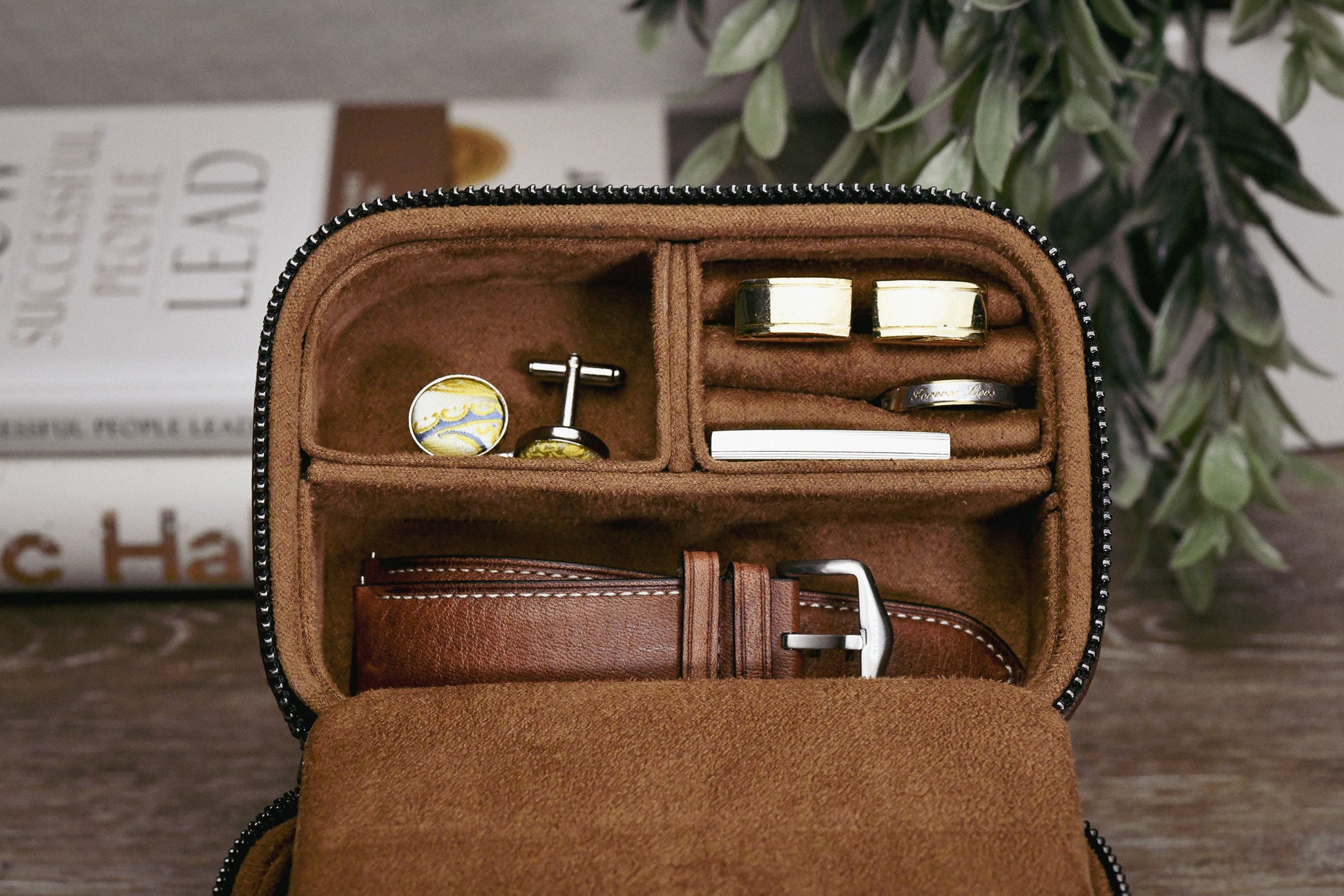 Coffee Brown genuine leather watch and jewelry travel case displayed open with luxury watches and jewelry in an elegant home setting.