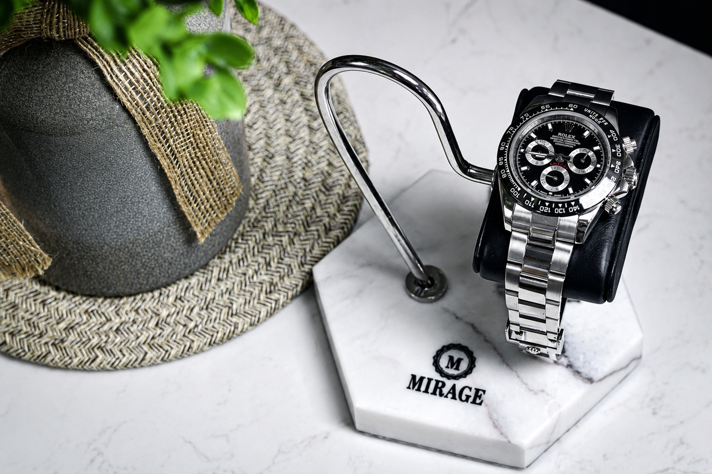 Luxury automatic watch displayed on the Mirage White Lilac Marble watch stand featuring a genuine black leather cushion and polished stainless steel support.