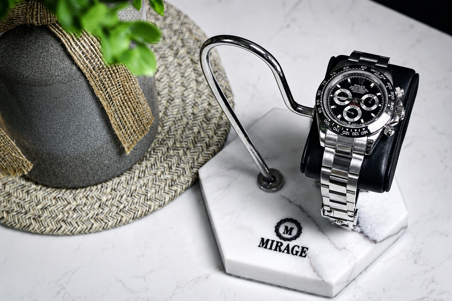 Luxury automatic watch displayed on the Mirage White Lilac Marble watch stand featuring a genuine black leather cushion and polished stainless steel support.