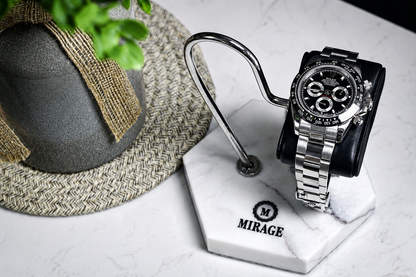 Luxury automatic watch displayed on the Mirage White Lilac Marble watch stand featuring a genuine black leather cushion and polished stainless steel support.
