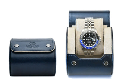 Closed and open Midnight Blue vegan leather 1 watch roll with blue suede interior displaying a luxury watch.
