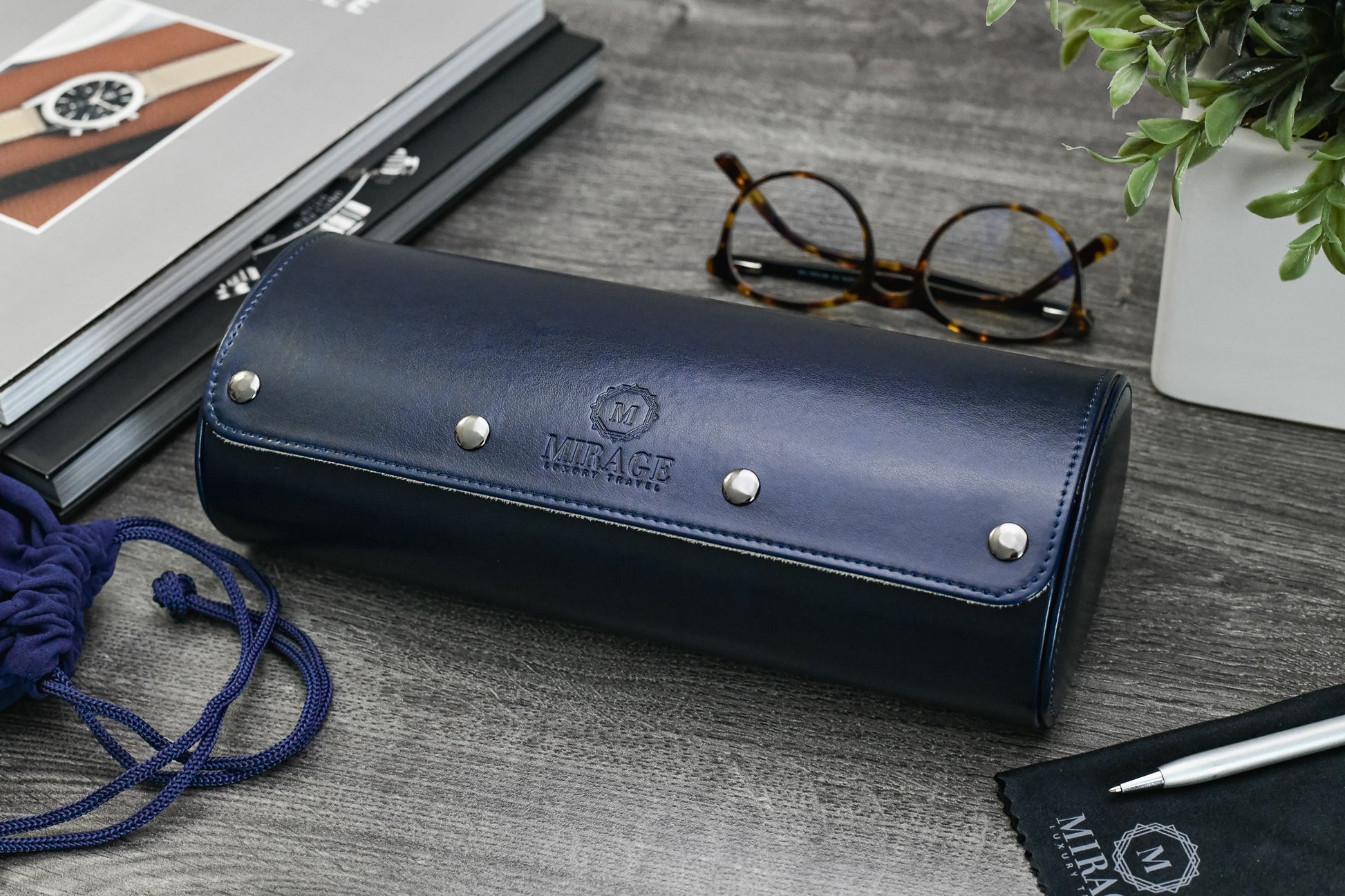 Closed Midnight Blue premium vegan leather 3 watch roll displayed with luxury watch accessories