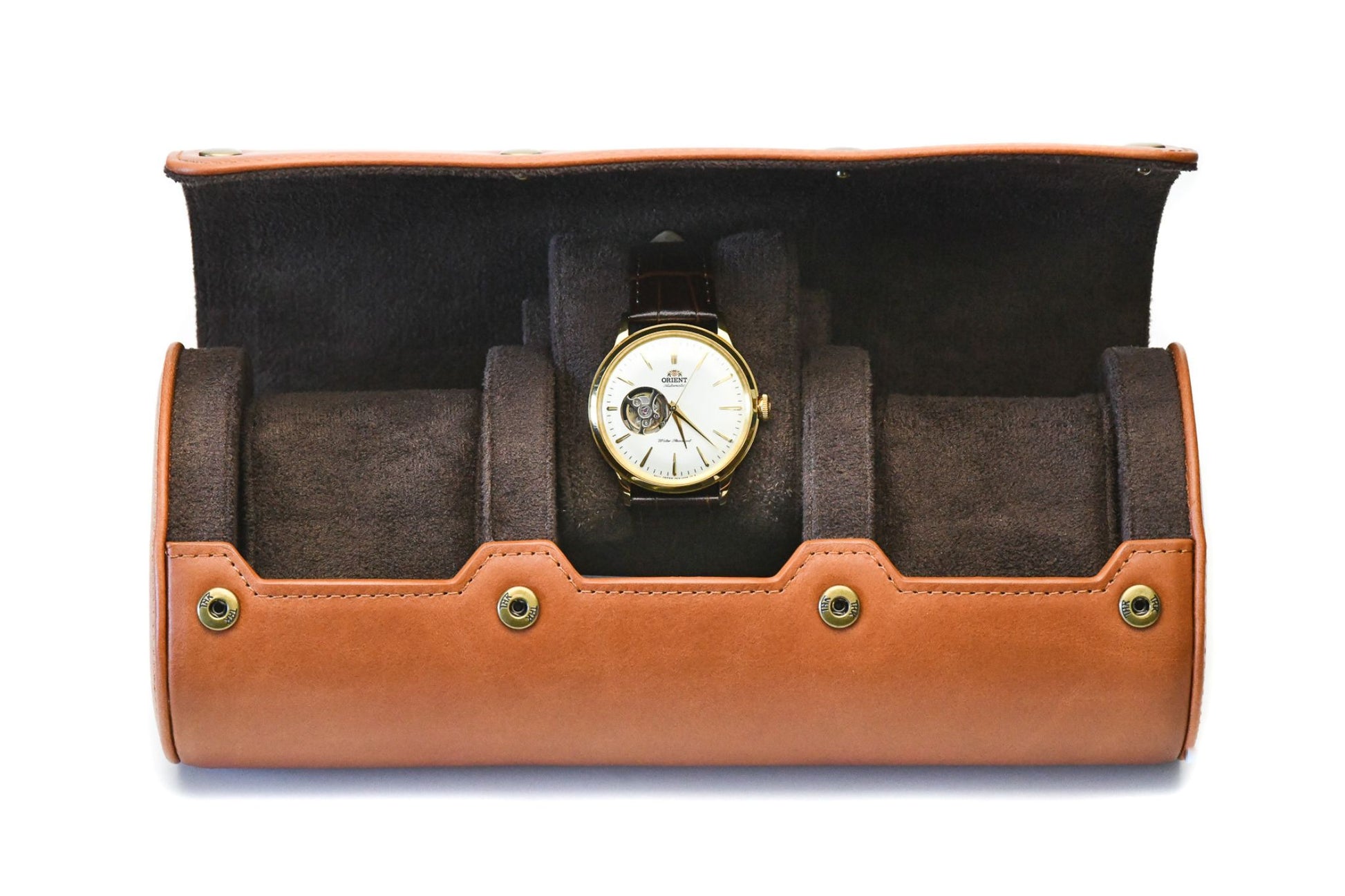 Close-up of the Mirage Luxury Travel logo embossed on Tawny Brown full-grain cow leather, showcasing premium craftsmanship and luxury detailing.