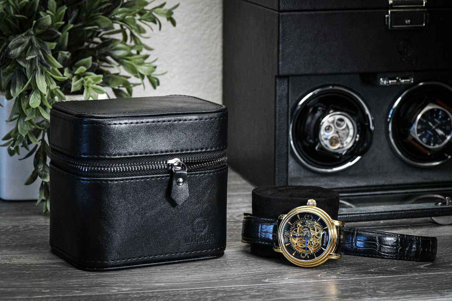 Obsedian Black genuine leather watch and jewelry travel case displayed with luxury watches, showcasing premium suede-lined protection and elegant organization.
