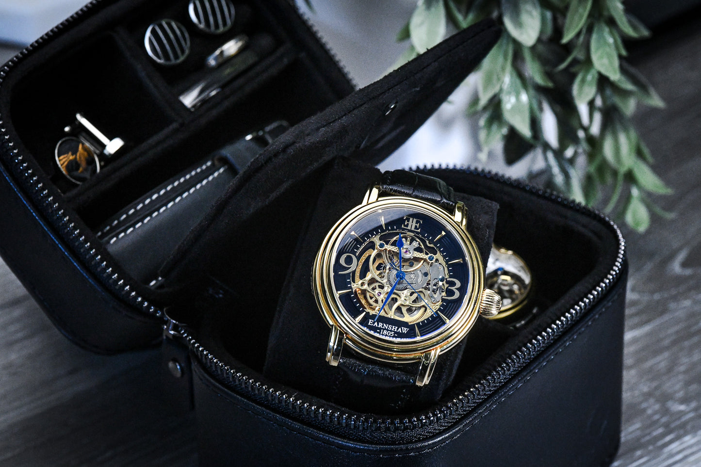 Open Obsedian Black genuine leather watch and jewelry travel case with premium suede-lined interior, luxury watches, rings, and organized storage compartments.
