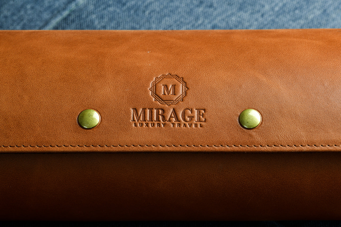 Custom engraving options available on the Mirage Luxury Travel Tawny Brown full-grain leather watch roll for personalized gifts.