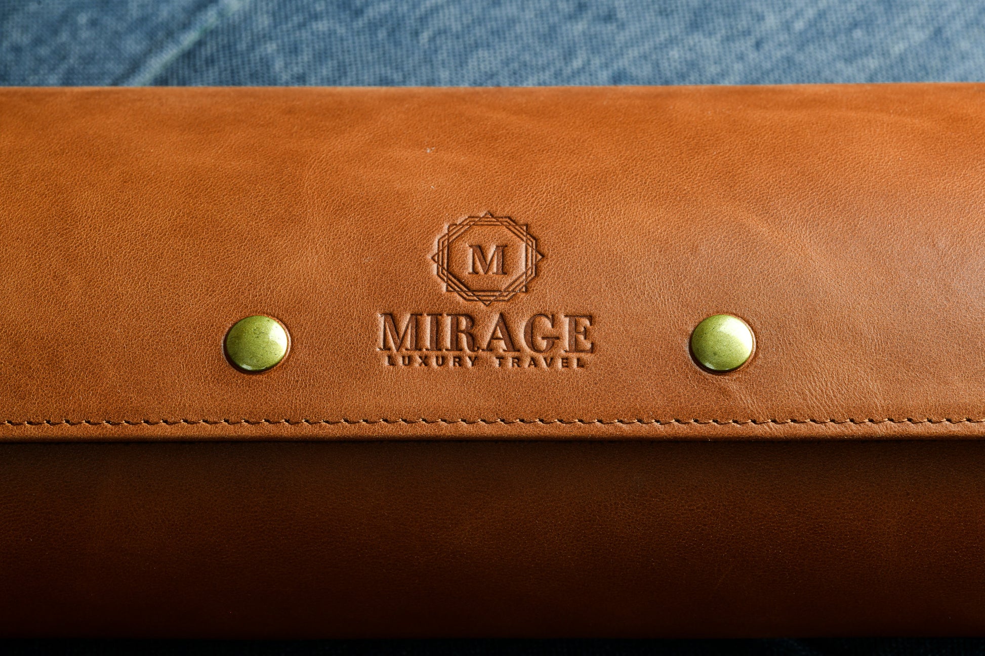 Custom engraving options available on the Mirage Luxury Travel Tawny Brown full-grain leather watch roll for personalized gifts.