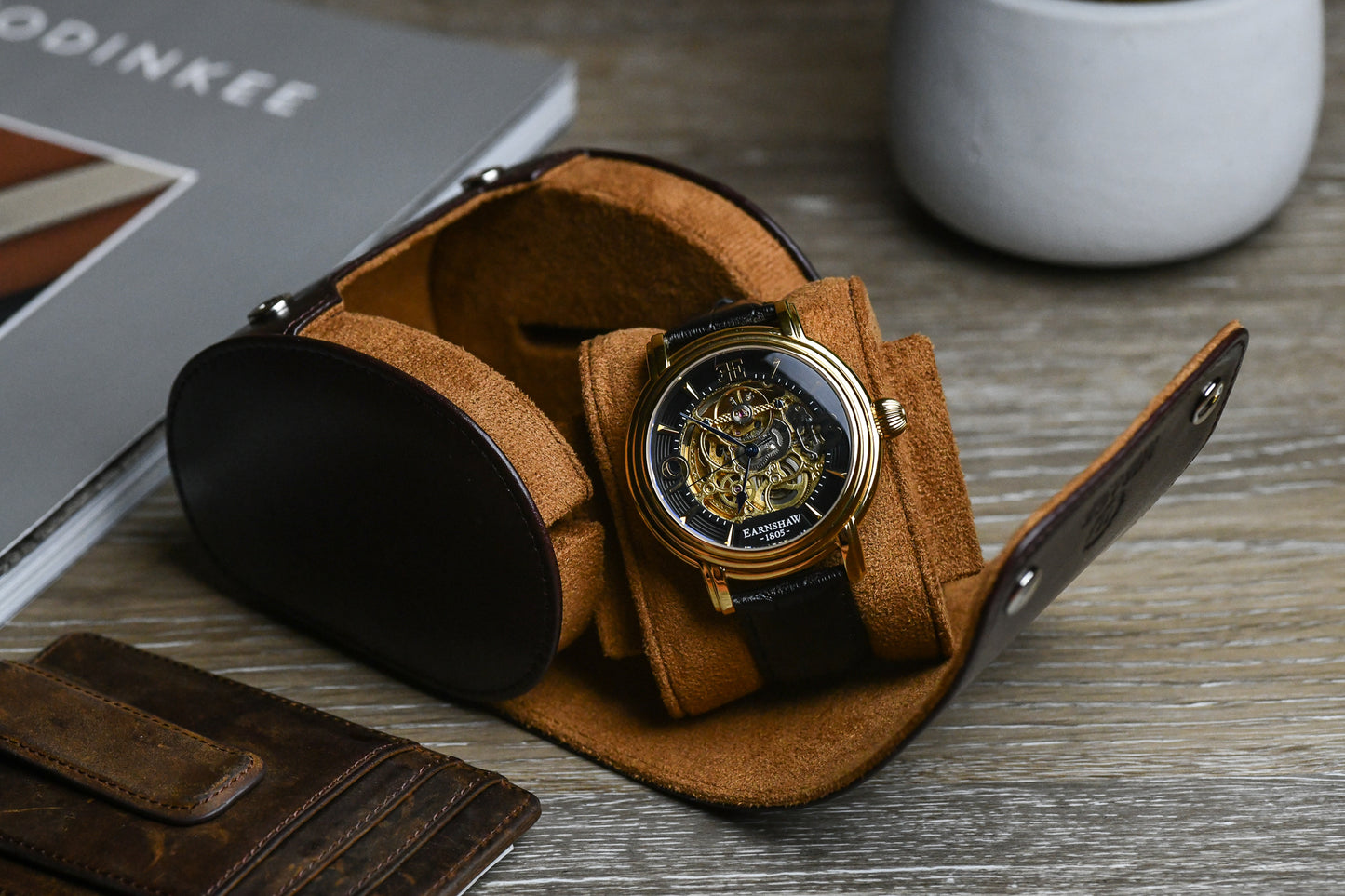 Close-up of a luxury watch secured inside the Mirage Signature Collection Espresso Brown premium vegan leather watch roll with a premium suede-lined interior.