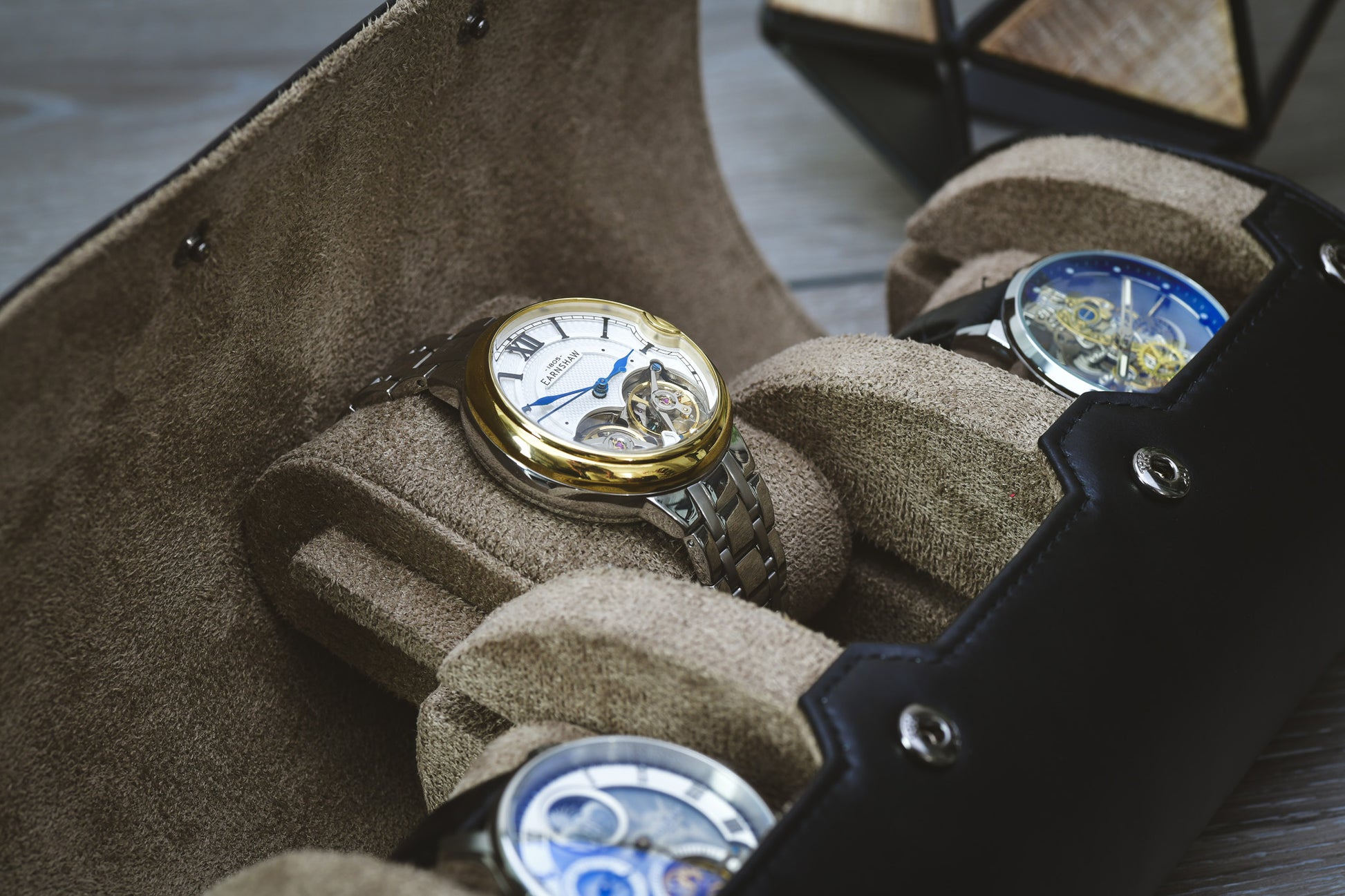 Close-up of the plush suede interior and sliding cushions protecting luxury watches inside the Mirage watch roll.