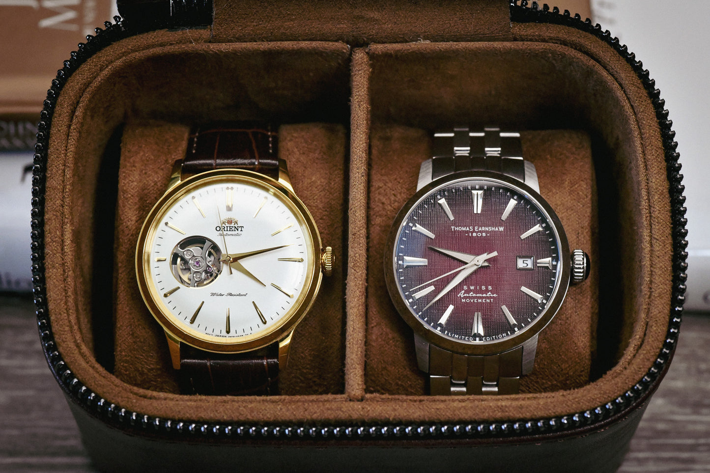 Premium suede-lined interior of the Coffee Brown genuine leather watch and jewelry travel case securely holding two luxury watches.
