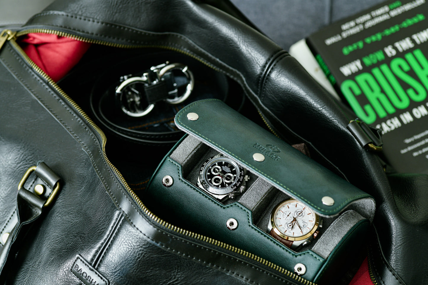 Royal Green vegan leather 2 watch travel case stored inside a leather duffel bag for business travel and luxury watch protection.