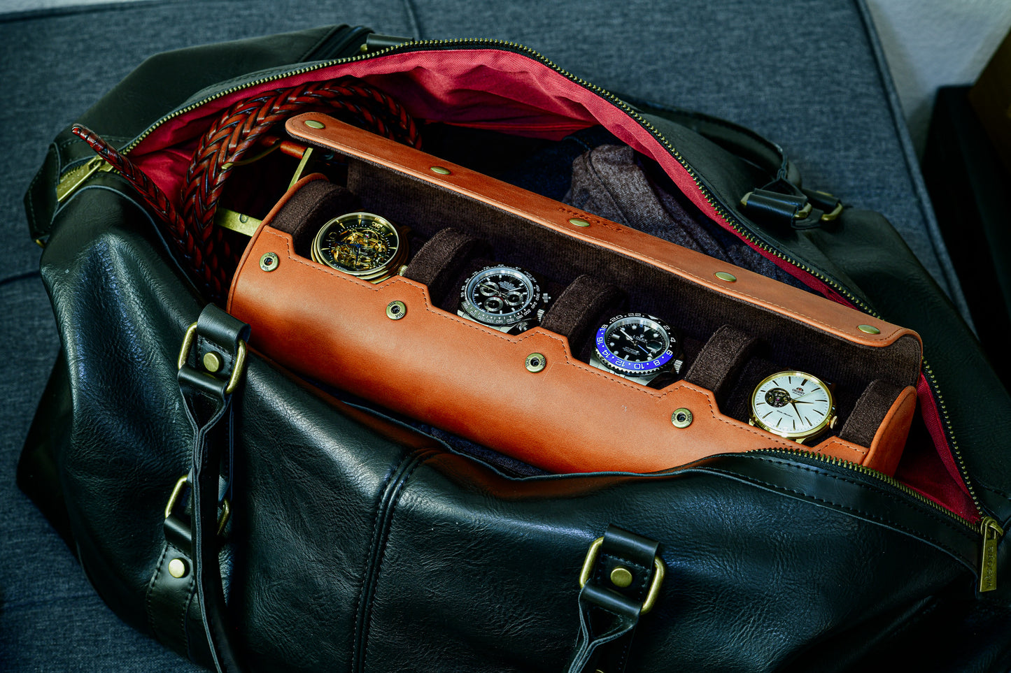 Luxury 4 watch roll travel case stored inside a travel duffel bag for secure transportation.