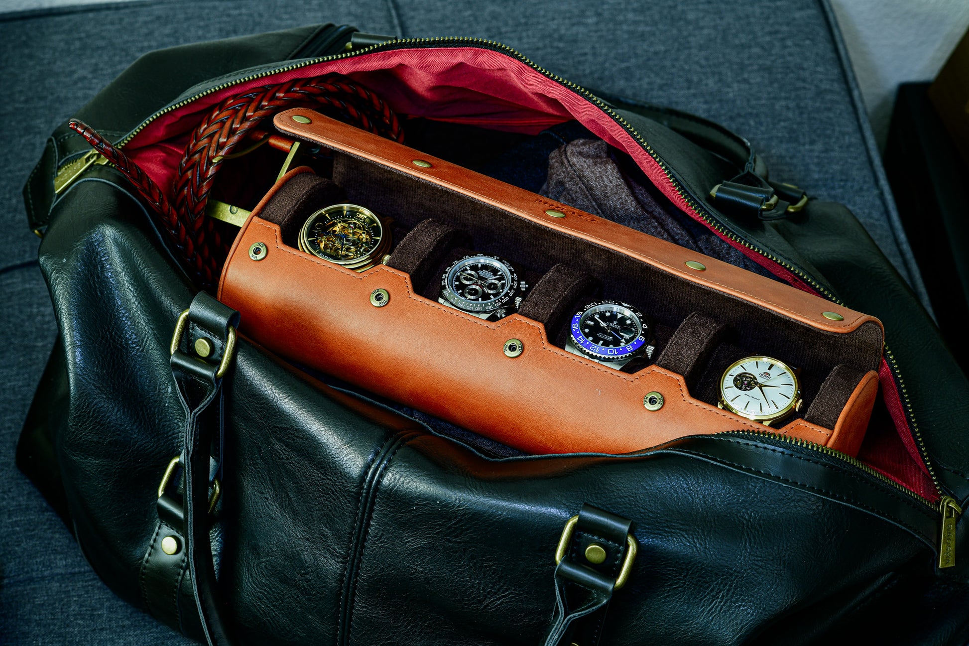 Luxury 4 watch roll travel case stored inside a travel duffel bag for secure transportation.