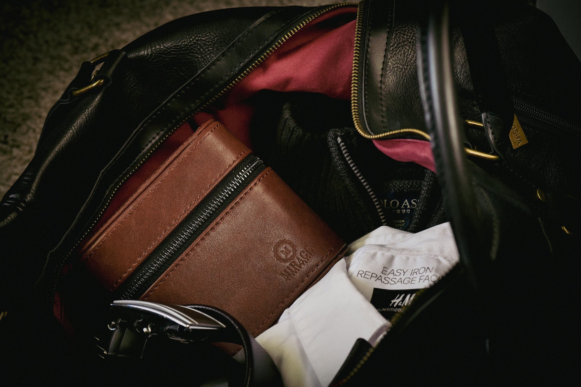 Coffee Brown genuine leather watch and jewelry travel case packed inside a travel bag, ideal for protecting luxury watches and jewelry on the go.