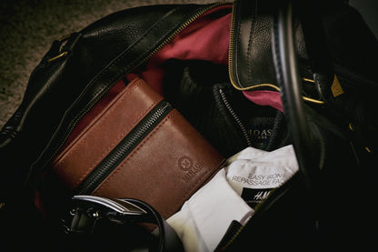 Coffee Brown genuine leather watch and jewelry travel case packed inside a travel bag, ideal for protecting luxury watches and jewelry on the go.