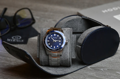 Close-up of a luxury watch secured inside the Mirage Luxury Travel Midnight Blue vegan leather 1 watch roll with plush blue suede lining and signature sliding cushion.