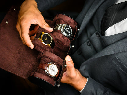 Watch collector placing luxury watches into Jade Black premium vegan leather 3 watch travel case