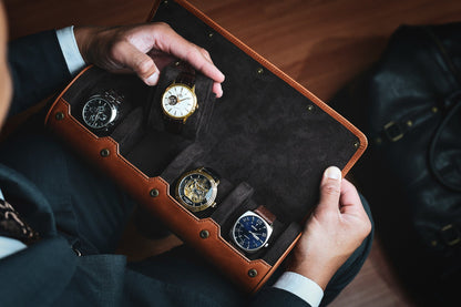 Collector holding Mirage Luxury Travel full-grain leather 4 watch roll travel case.