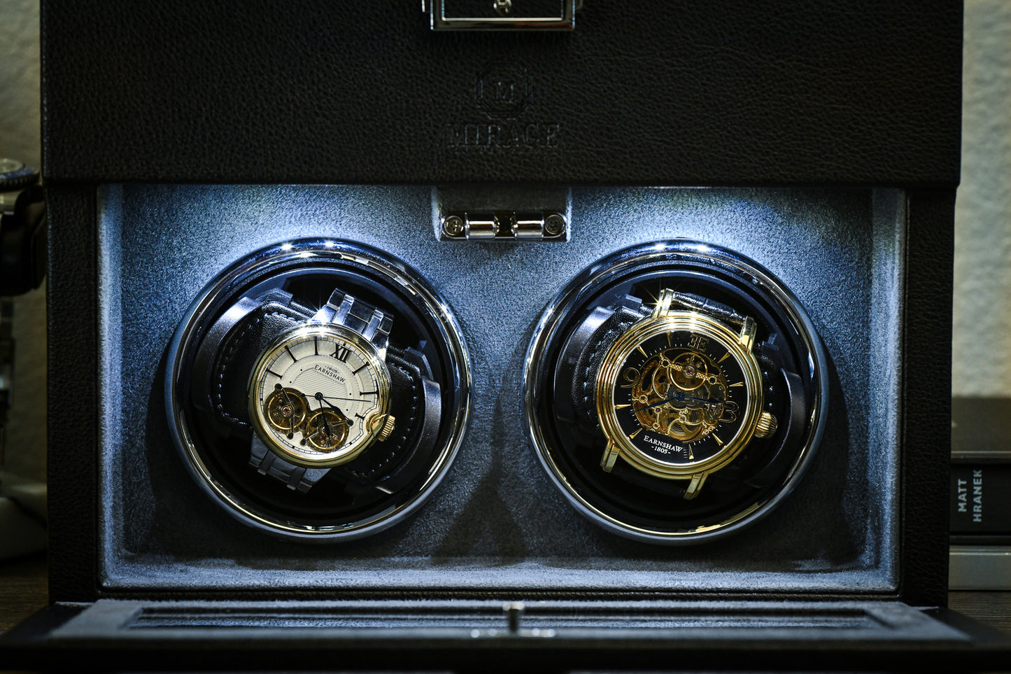 Premium suede-lined interior of the Ebony Black luxury watch winder securely winding two automatic watches.