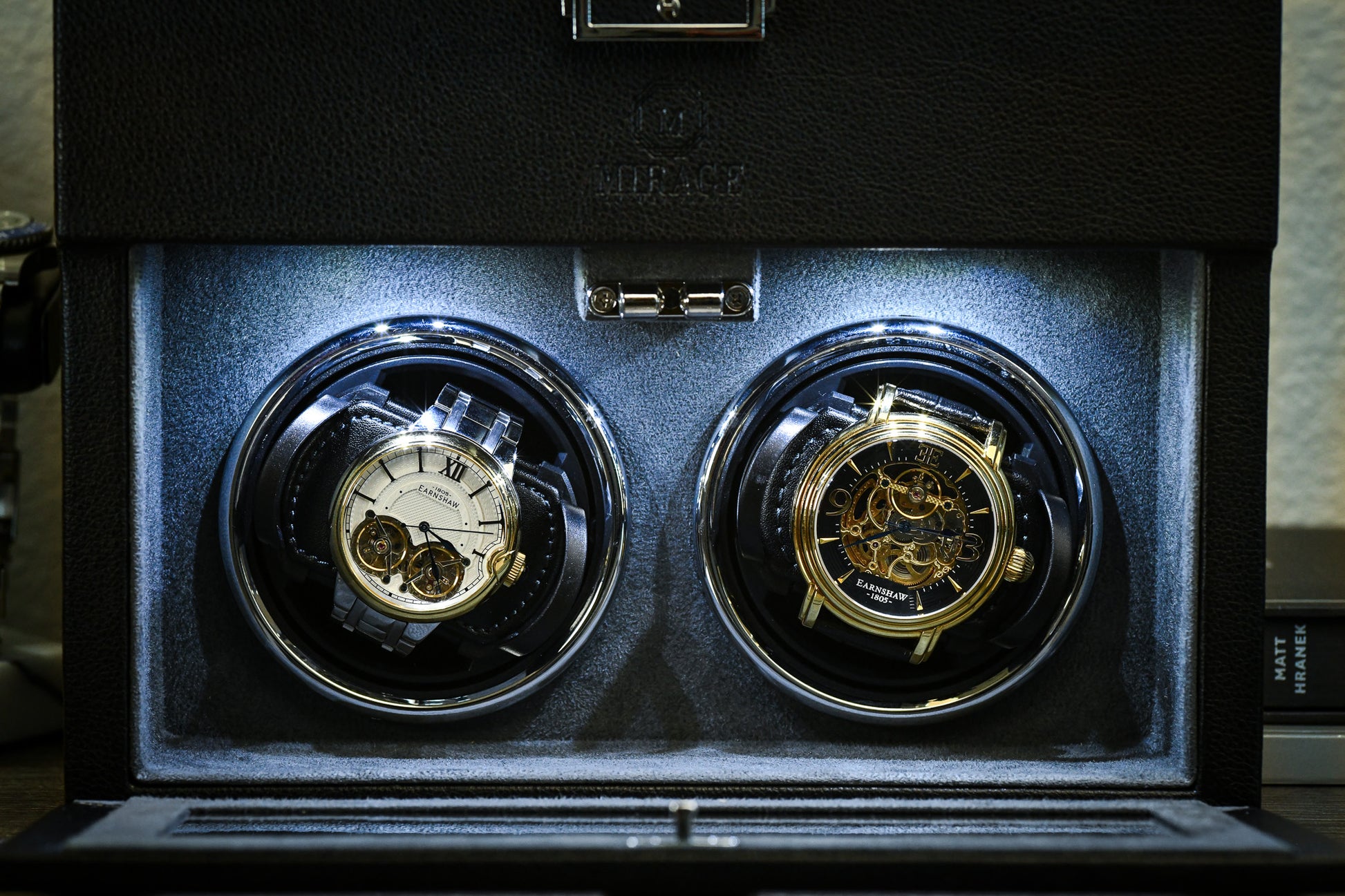 Premium suede-lined interior of the Ebony Black luxury watch winder securely winding two automatic watches.