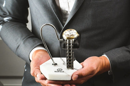 Mirage Luxury Travel Elite White Lilac Marble watch stand with genuine black leather cushion displayed in hand, showcasing an elegant luxury watch display for collectors.