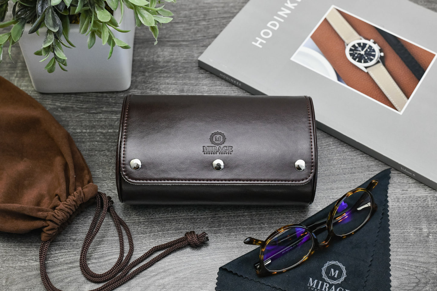 Espresso Brown vegan leather luxury watch roll displayed with sunglasses and premium travel accessories.