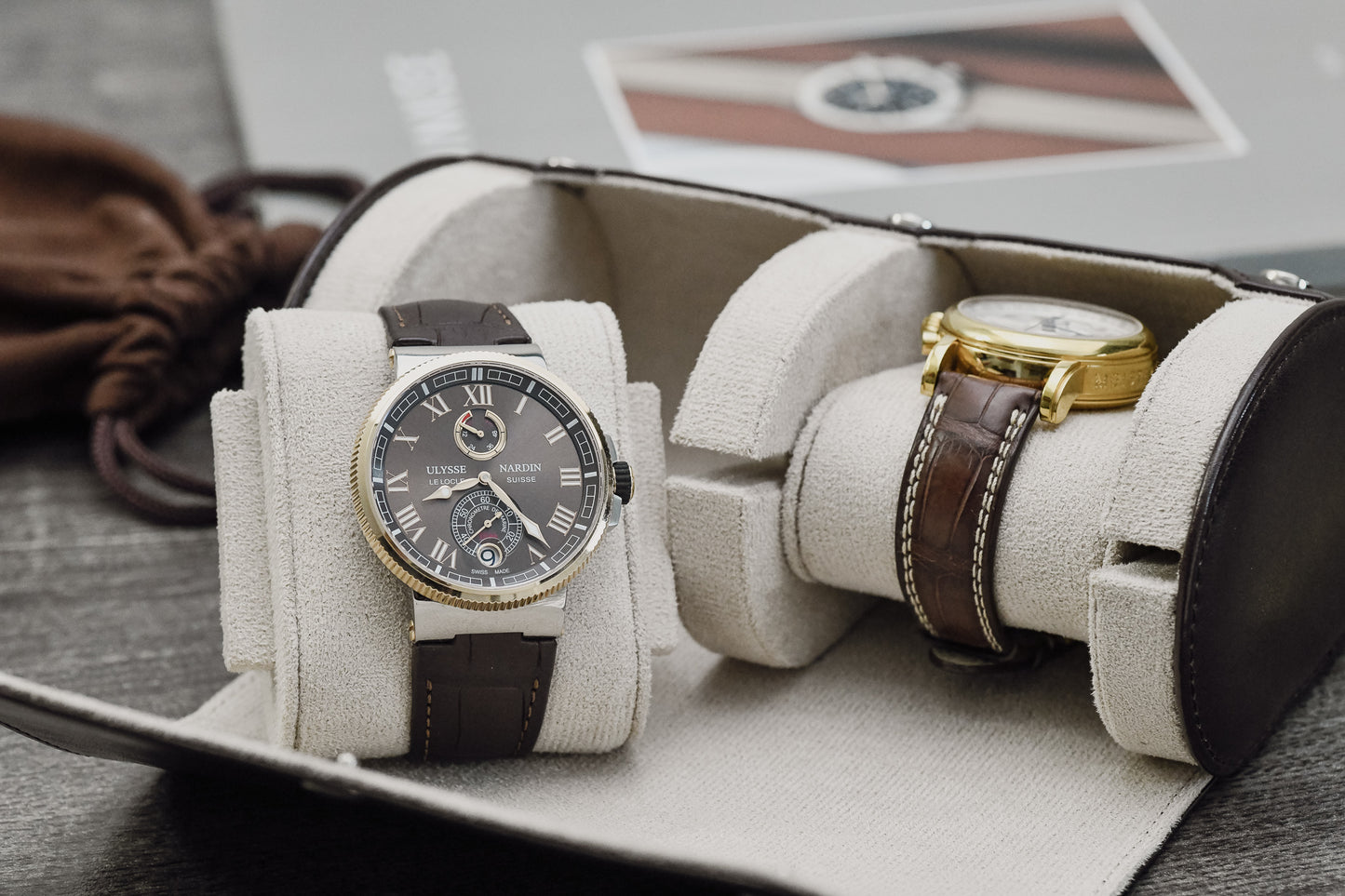 Premium Espresso Brown vegan leather watch organizer holding two luxury watches with ivory white suede interior.