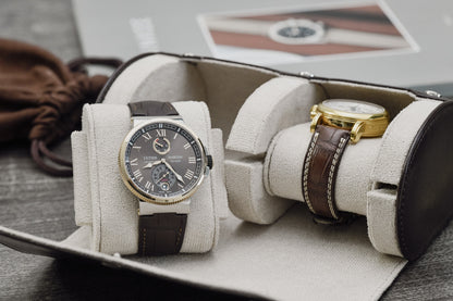Premium Espresso Brown vegan leather watch organizer holding two luxury watches with ivory white suede interior.