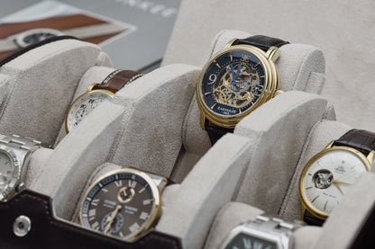 Close-up of luxury watches secured inside Espresso Brown 6 watch travel case with ivory white suede watch cushions