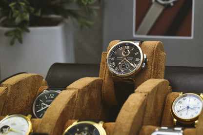 Close-up of luxury watch secured inside Espresso Brown suede-lined 6 watch travel organizer
