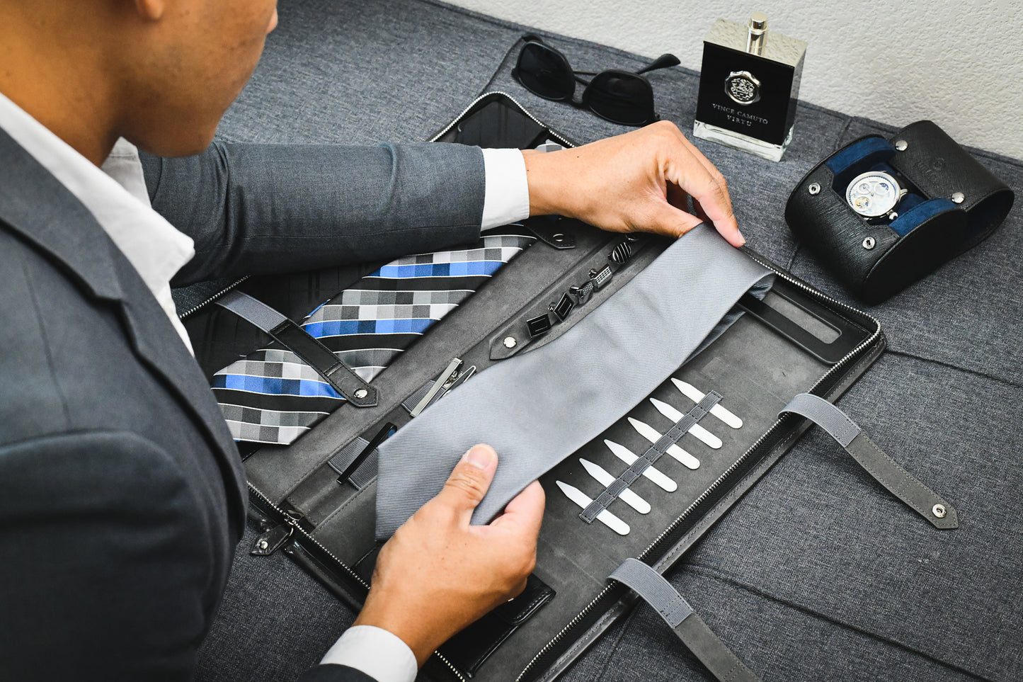 Professional organizing ties and formal accessories inside the Graphite Black premium vegan leather tie travel case.