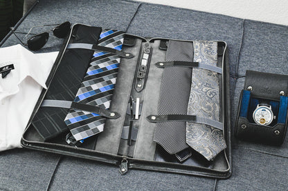 Open Graphite Black premium vegan leather tie travel case with organized ties, cufflinks, tie clips, and collar stays for business travel.