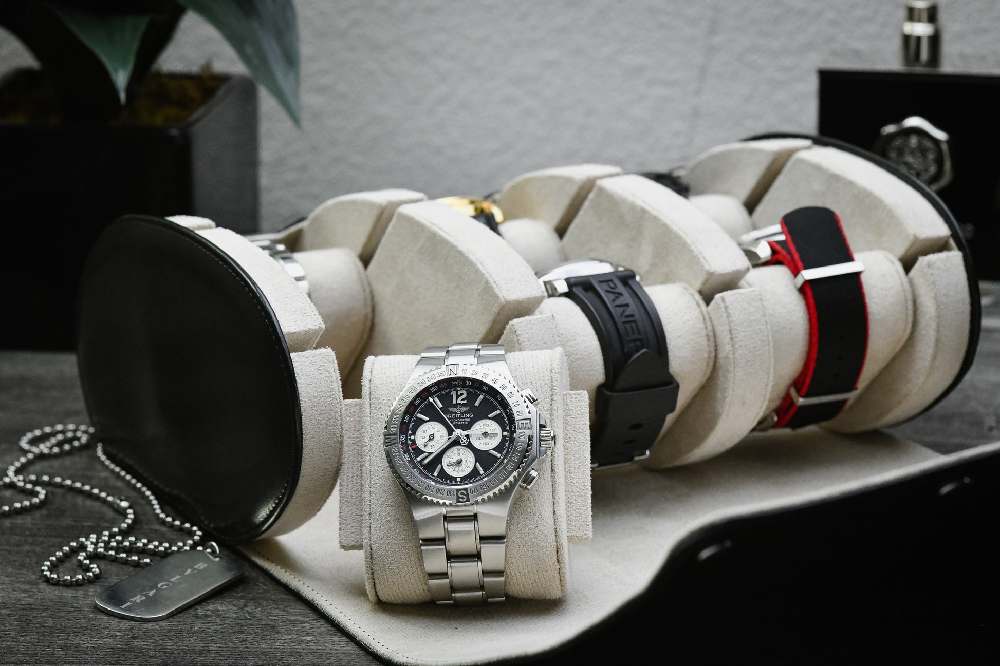 Premium Jade Black 6 watch roll with ivory white suede interior displaying luxury watches including Rolex, Omega, Breitling, Panerai, Tudor, Grand Seiko, Seiko, and Cartier in a premium vegan leather travel watch case.