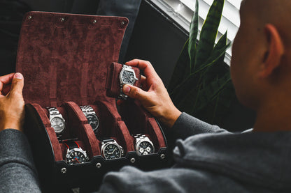 Watch collector organizing luxury watches inside the Jade Black premium vegan leather 6 watch roll