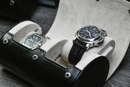Close-up of luxury watches resting inside the Jade Black vegan leather 2 watch organizer with soft ivory white suede lining.