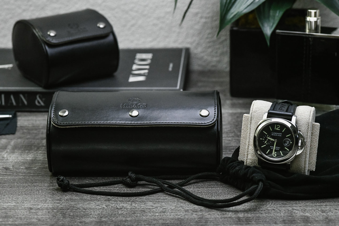 Luxury gifting presentation featuring the Jade Black vegan leather 2 watch roll with ivory white interior.