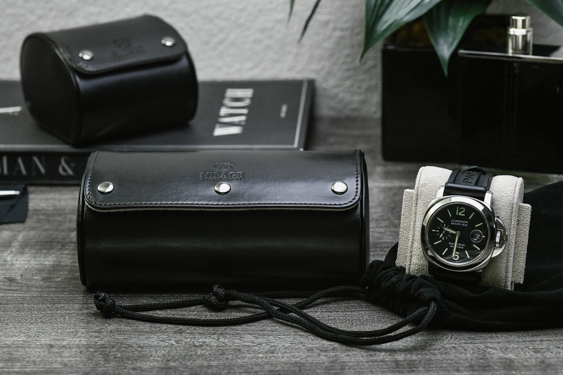 Luxury gifting presentation featuring the Jade Black vegan leather 2 watch roll with ivory white interior.