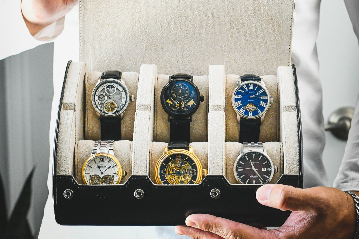 Premium Jade Black and ivory white 6 watch roll displaying Rolex Omega Tudor and Grand Seiko watches