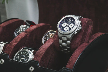 Close-up of luxury watches secured inside the Jade Black suede-lined 6 watch travel organizer