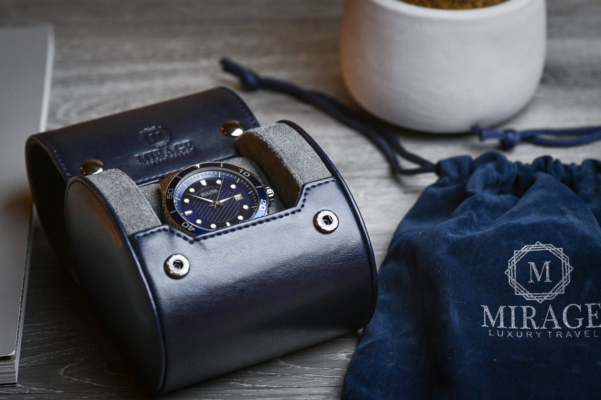 Midnight Blue vegan leather 1 watch roll displayed beside luxury accessories for elegant bedside watch storage.